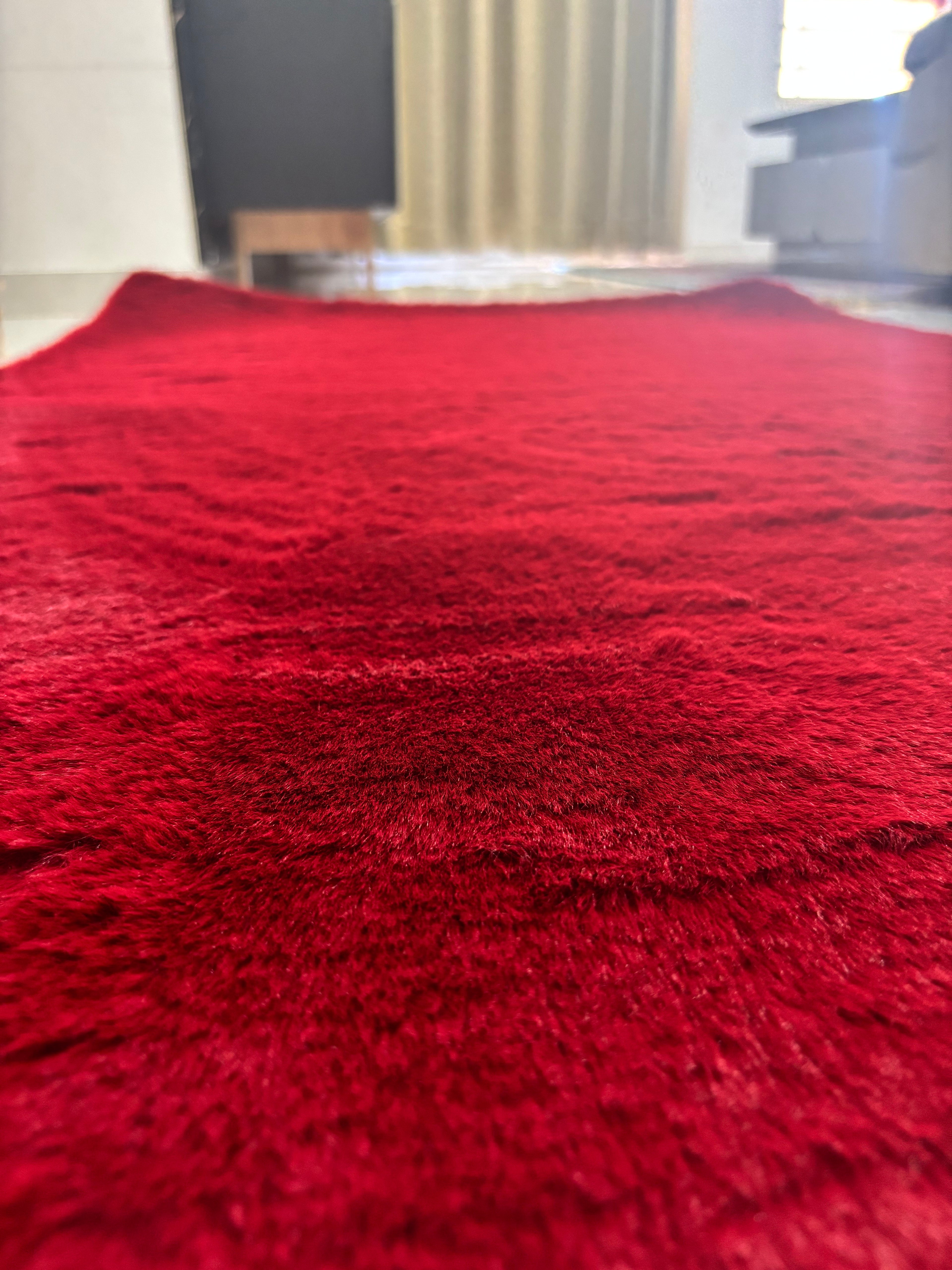 Elevate your living space with the striking beauty of our Rose Red Fur Carpet. Designed with a high-density pile that mimics the touch of genuine fur, this rug brings a sophisticated "glam" factor to any room.